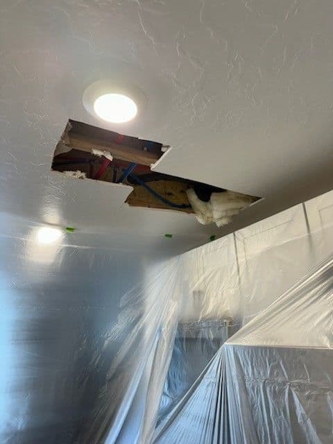 Flood damage from a failed tub drain — before